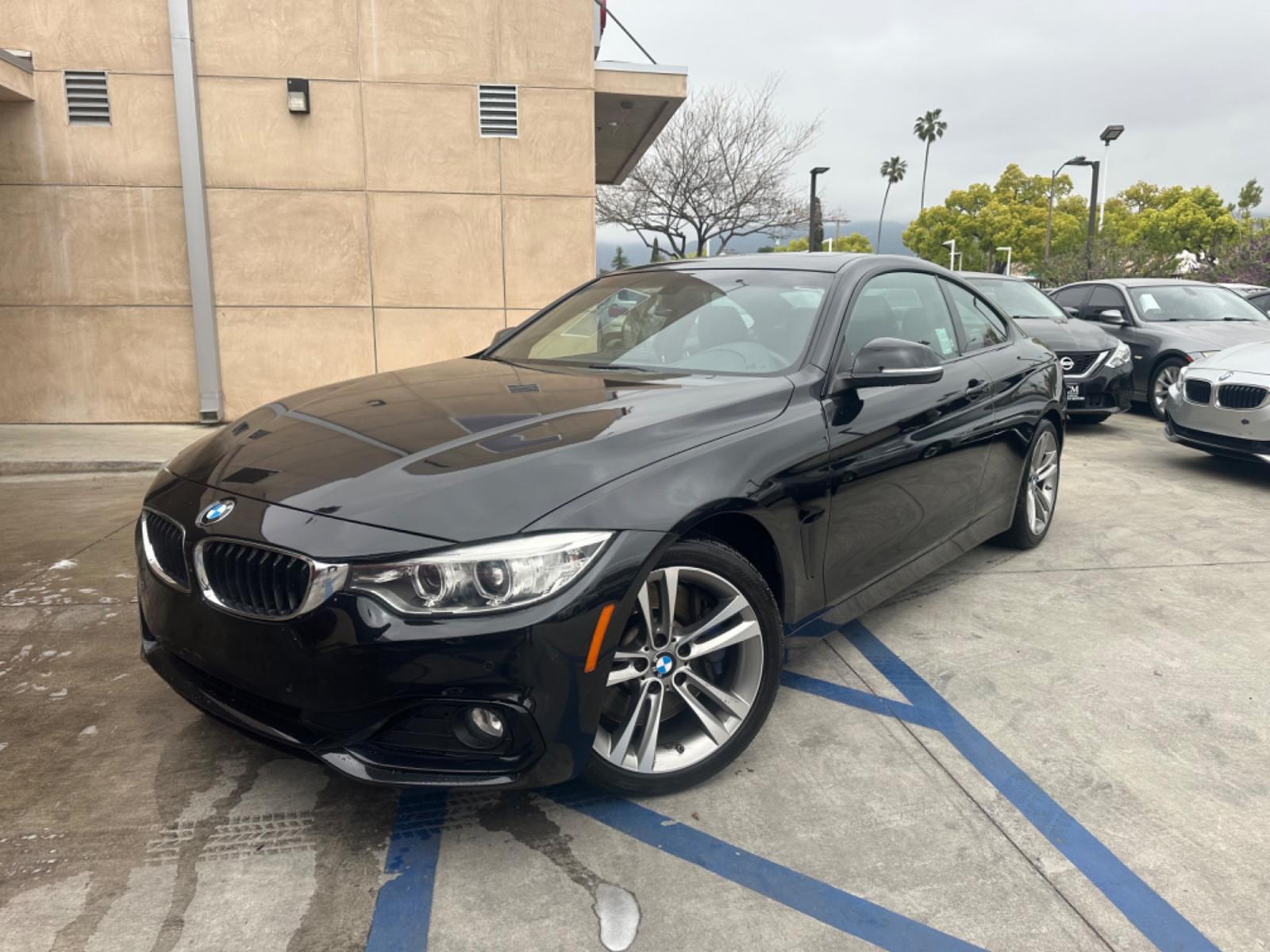 2015 Black BMW 4-Series 435i coupe (WBA3R1C55FK) with an 3.0L V6 DOHC 24V engine, 8-Speed Automatic transmission, located at 30 S. Berkeley Avenue, Pasadena, CA, 91107, (626) 248-7567, 34.145447, -118.109398 - Crown City Motors is a used “Buy Here Pay Here” car dealer in Pasadena CA. “Buy Here Pay Here” financing, means that when you purchase your vehicle from our dealership, that you make the payments to the dealership as well. We do not need the banks approval to get you approved for a used auto - Photo #0